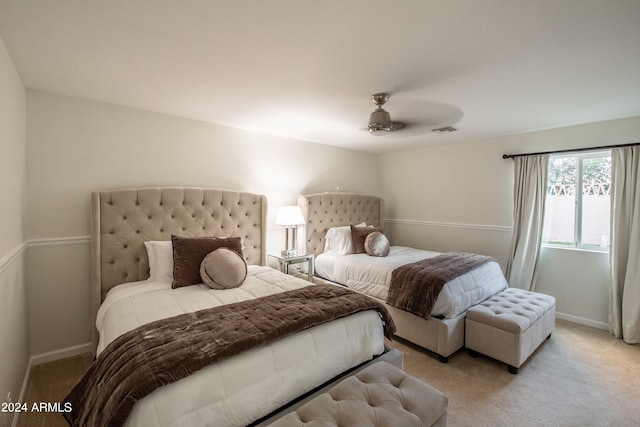 bedroom featuring ceiling fan and light colored carpet