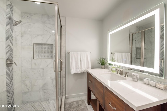 bathroom with walk in shower, tile patterned flooring, and vanity