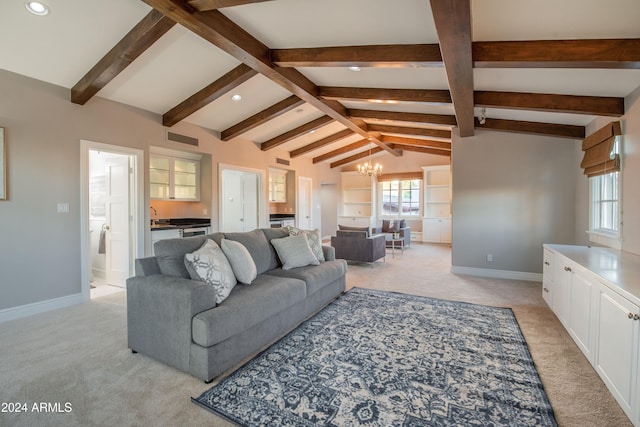 living room featuring lofted ceiling with beams, an inviting chandelier, and light colored carpet