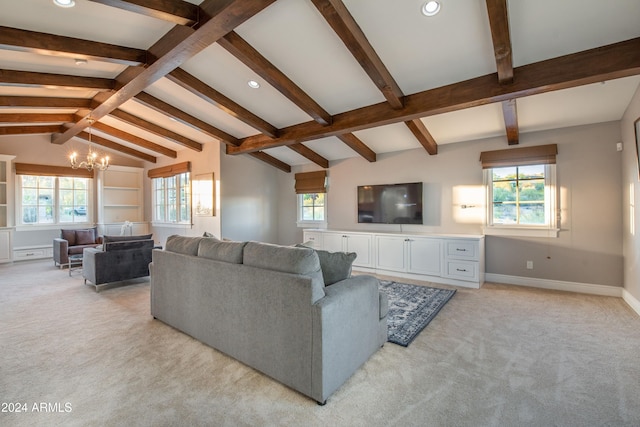 living room featuring plenty of natural light, light carpet, and lofted ceiling with beams