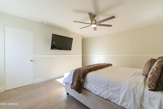 bedroom with hardwood / wood-style flooring and ceiling fan