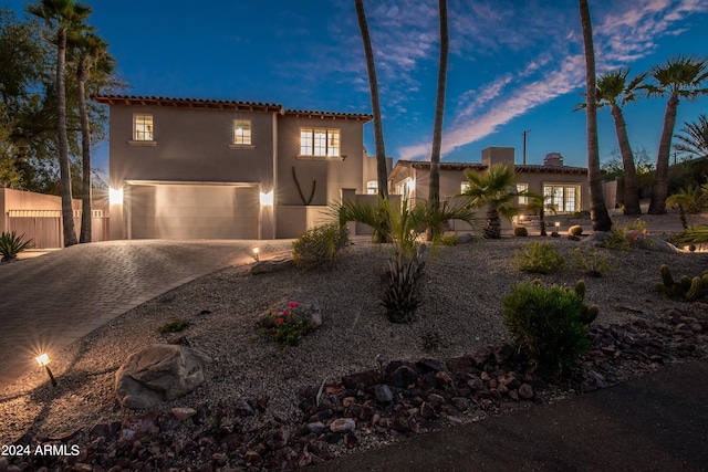 mediterranean / spanish-style house featuring a garage