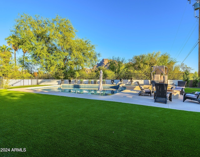 view of yard with a fenced in pool, a patio, and an outdoor hangout area