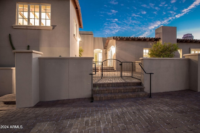 view of patio terrace at dusk