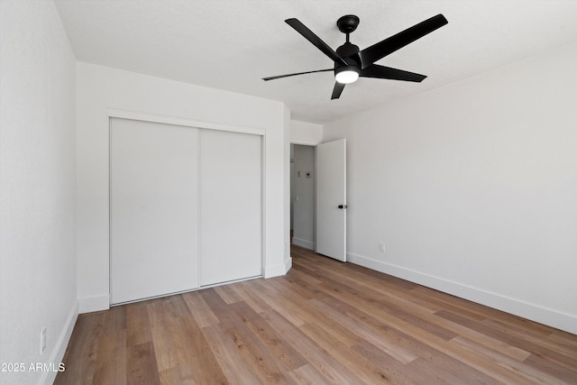 4439 W Cielo Grande, Glendale, AZ 85310 - unfurnished bedroom with a closet, light wood-style floors, and a ceiling fan
