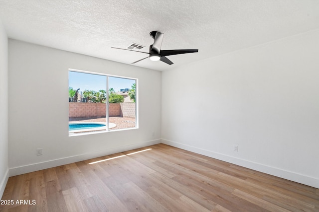 4439 W Cielo Grande, Glendale, AZ 85310 - spare room with wood finished floors, ceiling fan, and a textured ceiling