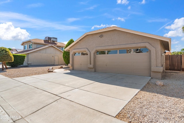4439 W Cielo Grande, Glendale, AZ 85310 - view of front facade with stucco siding, concrete driveway, and an attached garage