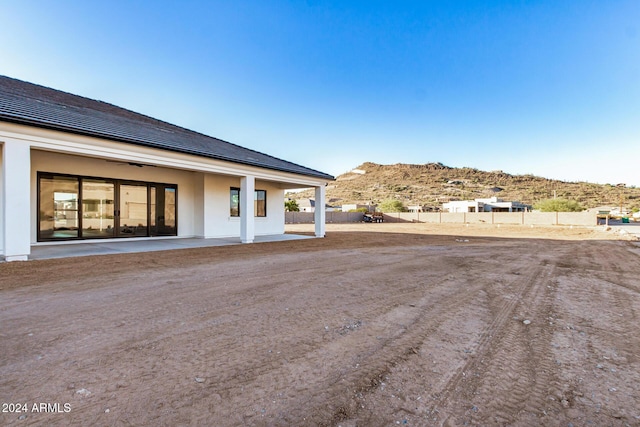 exterior space with a patio area and a mountain view