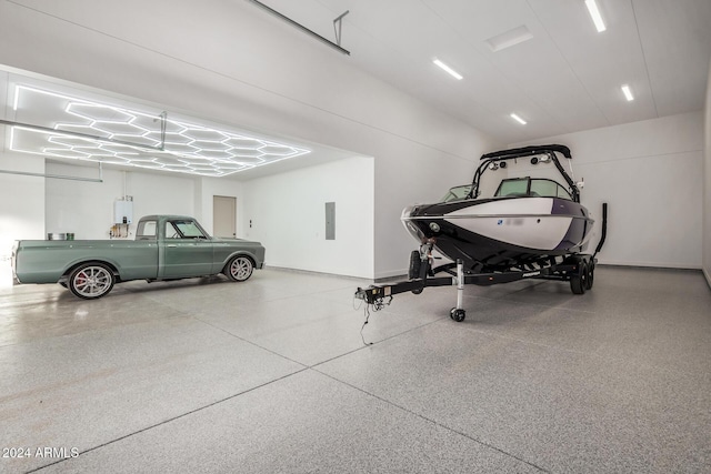 garage with electric panel and water heater