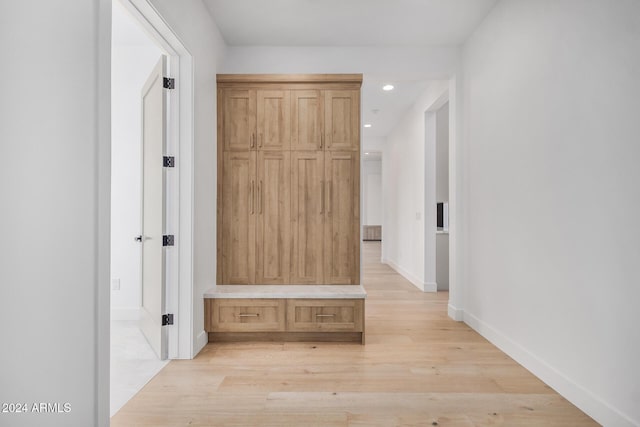 hallway with light wood-type flooring