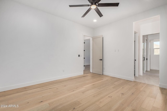 unfurnished room featuring ceiling fan and light hardwood / wood-style floors