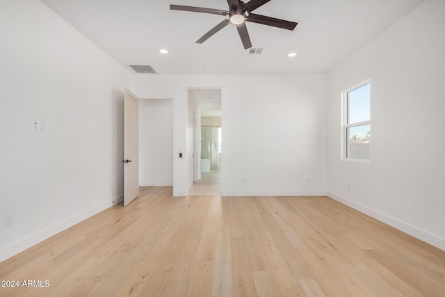 unfurnished room featuring ceiling fan and light hardwood / wood-style floors