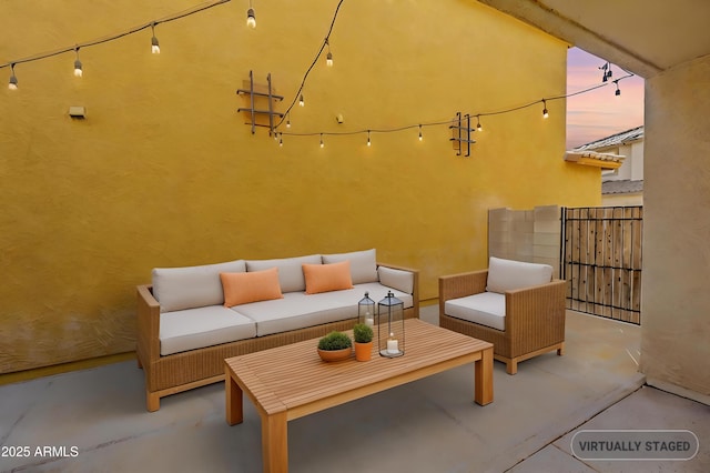 view of patio / terrace with fence and an outdoor living space