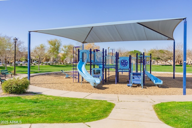 community play area with a lawn