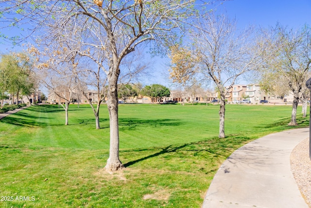 view of home's community with a yard and a residential view