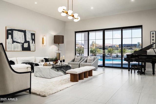 living room featuring a chandelier and a healthy amount of sunlight