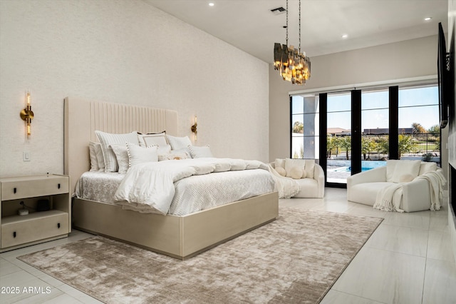 tiled bedroom with a notable chandelier and access to outside