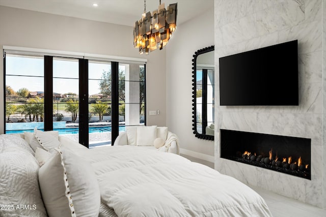 bedroom featuring a large fireplace