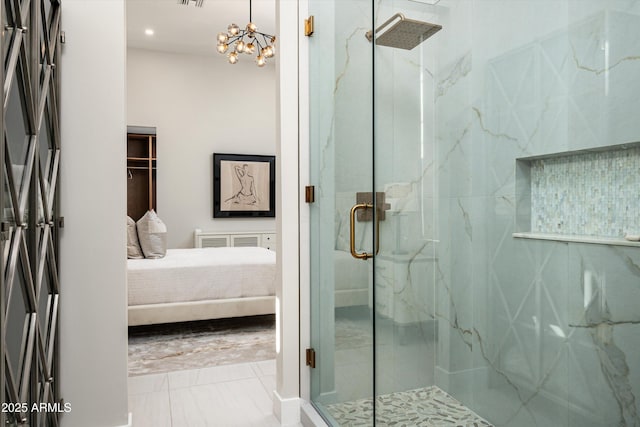 bathroom featuring walk in shower and a notable chandelier