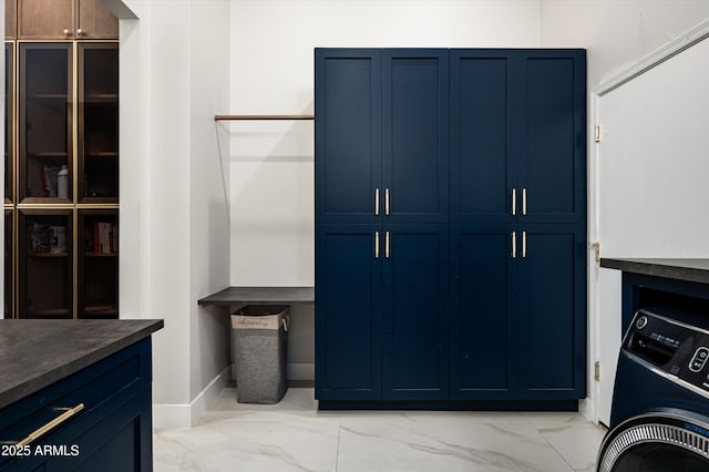 laundry area featuring cabinets and washer / clothes dryer