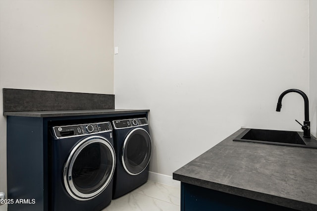 washroom featuring sink and washer and clothes dryer