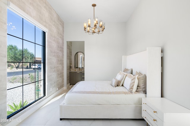 bedroom with an inviting chandelier and ensuite bath