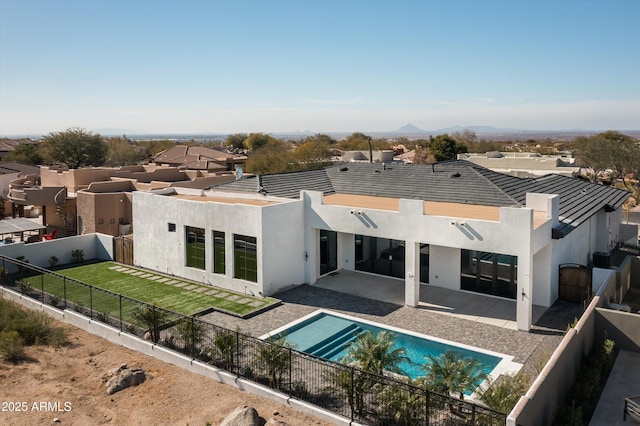 rear view of house with a patio area