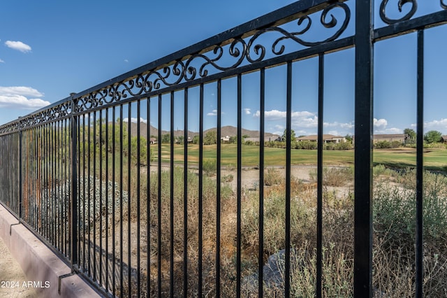 view of gate with a yard