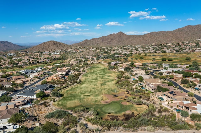 birds eye view of property with a mountain view