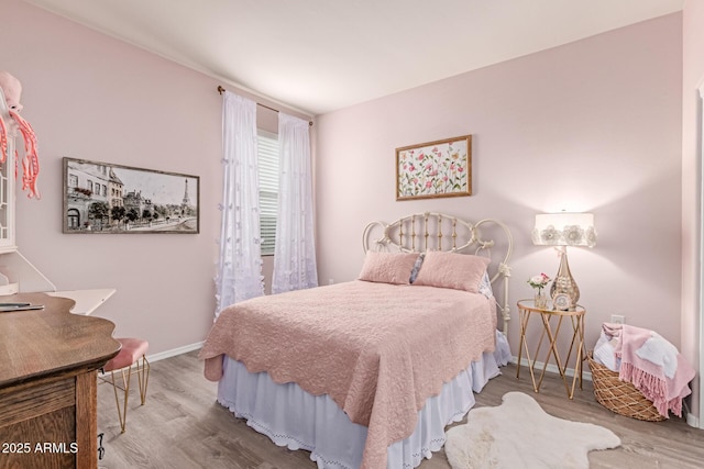 9429 E Grapefruit Dr, Florence, AZ 85132 - bedroom with wood finished floors and baseboards