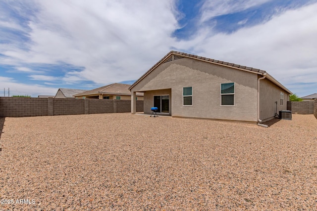 9429 E Grapefruit Dr, Florence, AZ 85132 - rear view of property with central air condition unit, a fenced backyard, and stucco siding