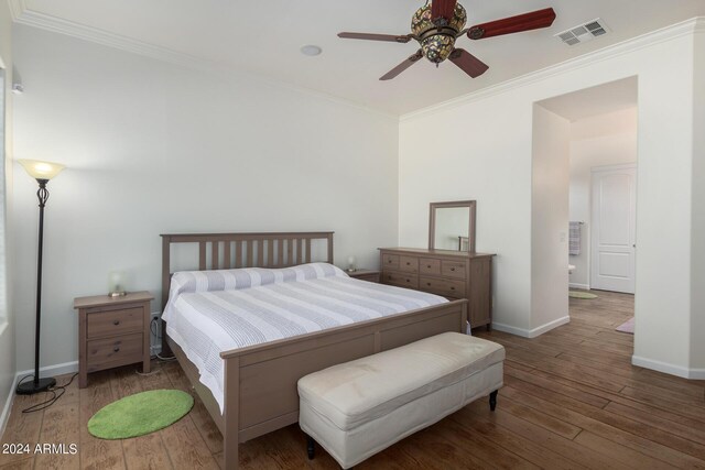 bedroom featuring crown molding, dark hardwood / wood-style floors, and ceiling fan