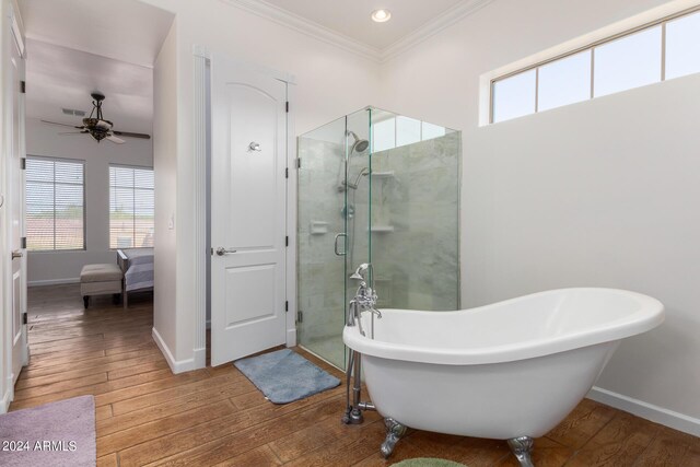 bathroom featuring independent shower and bath, hardwood / wood-style flooring, crown molding, and ceiling fan