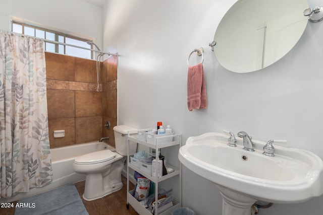 full bathroom featuring shower / tub combo with curtain, wood-type flooring, sink, and toilet