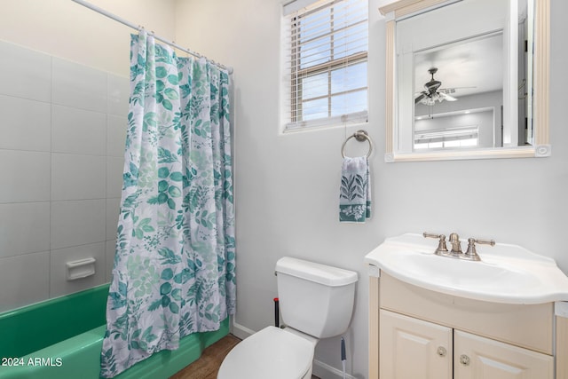 full bathroom featuring ceiling fan, vanity, wood-type flooring, shower / bathtub combination with curtain, and toilet