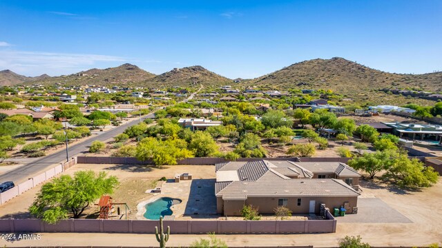 birds eye view of property featuring a mountain view