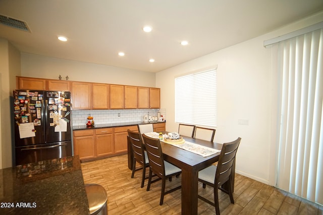 dining area with light hardwood / wood-style floors