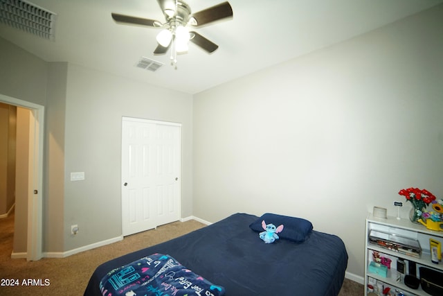 carpeted bedroom with ceiling fan