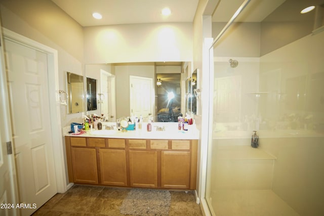 bathroom with vanity and walk in shower