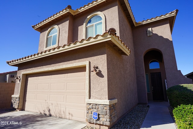 view of front of property with a garage