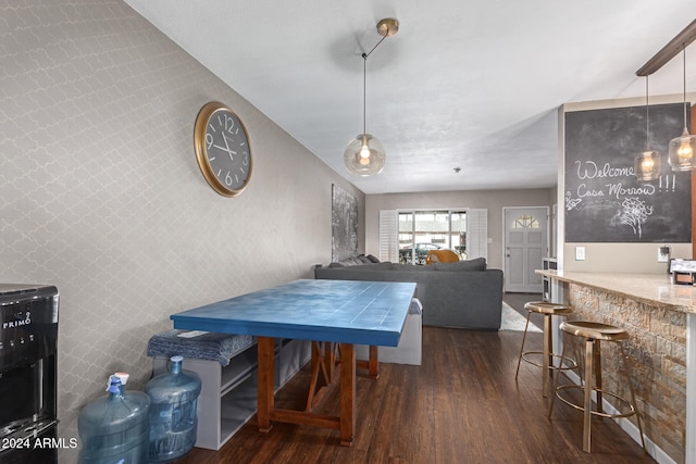 dining area featuring dark wood-type flooring