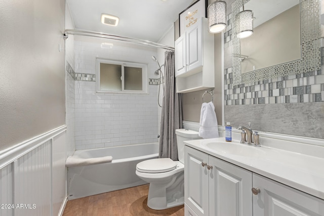 full bathroom with vanity, hardwood / wood-style floors, shower / bath combo, and toilet