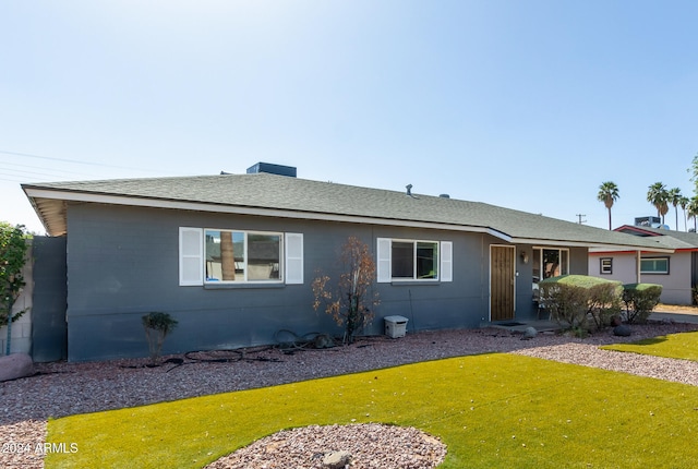 ranch-style house with a front lawn