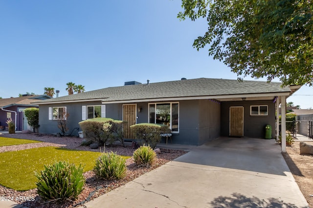 ranch-style house with a carport