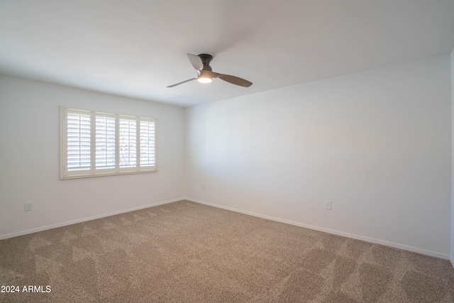 empty room with carpet and ceiling fan