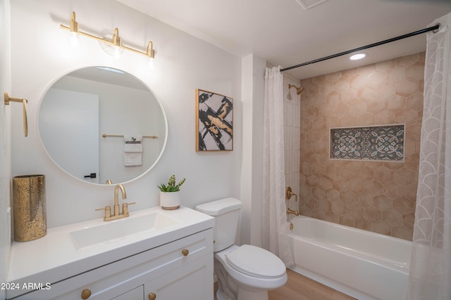 full bathroom featuring hardwood / wood-style flooring, vanity, toilet, and shower / tub combo