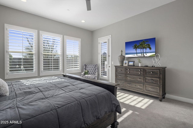 carpeted bedroom featuring ceiling fan