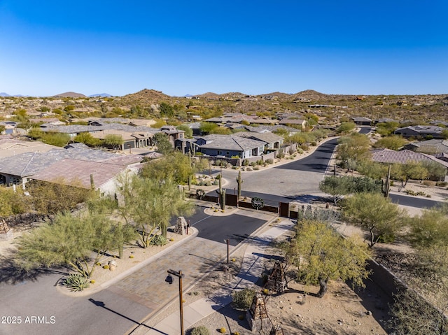 birds eye view of property with a mountain view