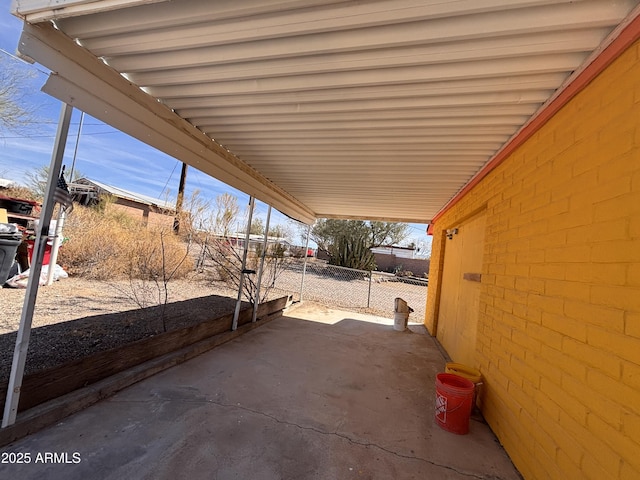 view of patio / terrace featuring fence