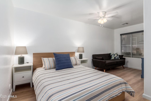 bedroom featuring hardwood / wood-style flooring and ceiling fan